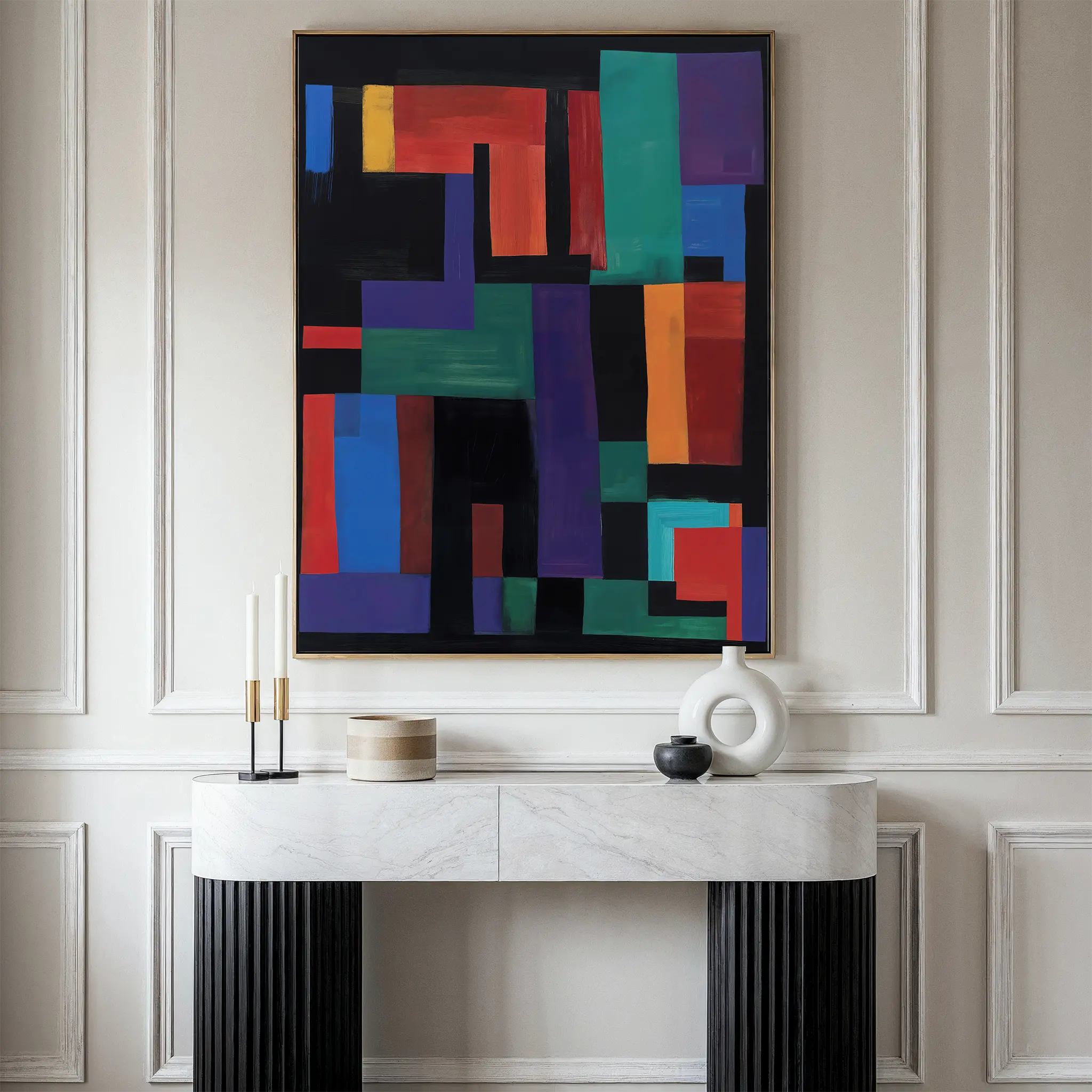 A modern entryway features a white marble console table with black ribbed legs, decorative vases, and candles. Above it hangs the Geometric Mosaic Canvas Art on a beige paneled wall.
