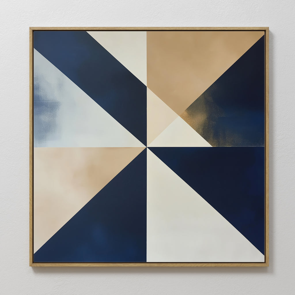 The Geometric Night Canvas Art is a square wall piece with navy, beige, white, and gold triangles converging at the center. Framed in a slim wood border, this minimalist art adds an elegant touch to any white wall.