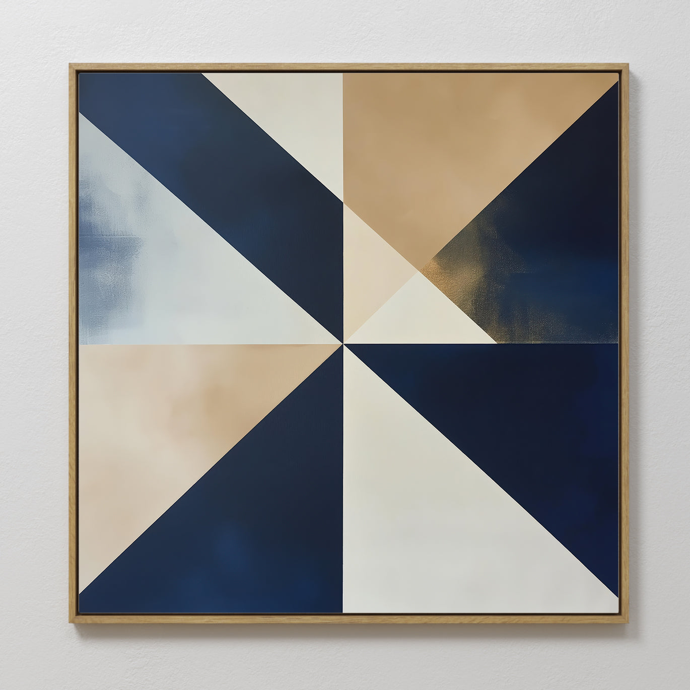 The Geometric Night Canvas Art is a square wall piece with navy, beige, white, and gold triangles converging at the center. Framed in a slim wood border, this minimalist art adds an elegant touch to any white wall.