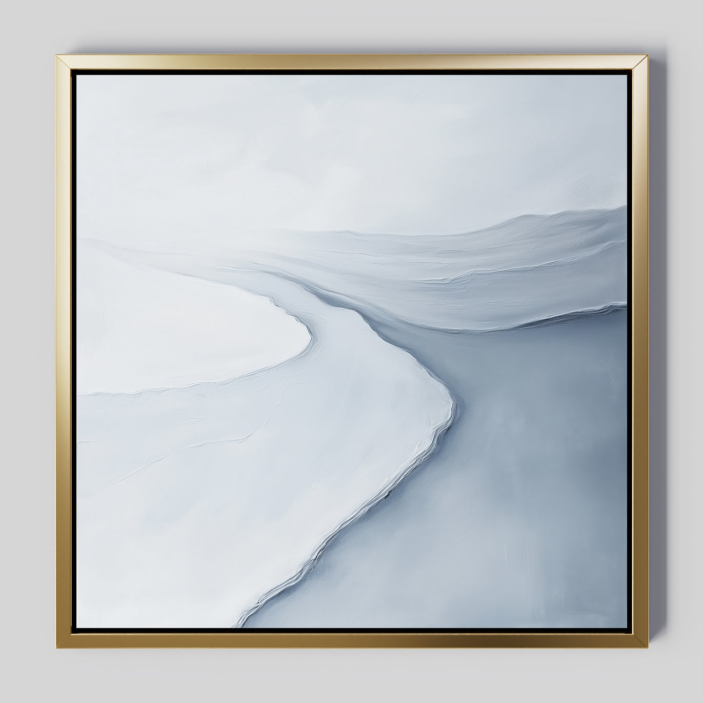 Glacial Flow Canvas Art features a minimalist abstract icy landscape in white and blue with soft, curving lines and textured layers—perfect as modern wall art for your living room, framed in gold against a light gray wall.