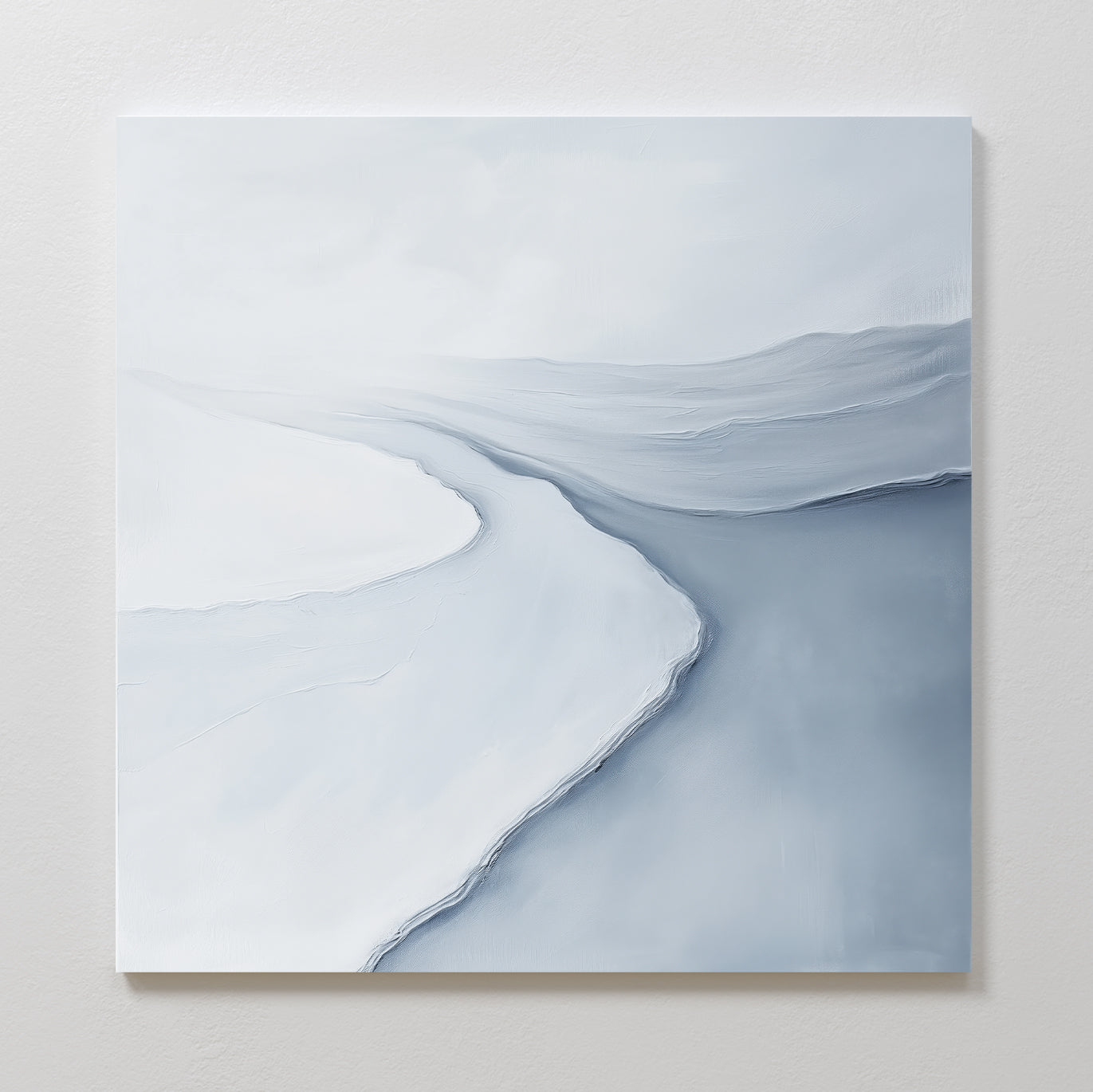 The Glacial Flow Canvas Art features cool tones and abstract, softly blended snowy landscapes with a winding river beneath a pale sky—ideal as modern wall art for your living room.