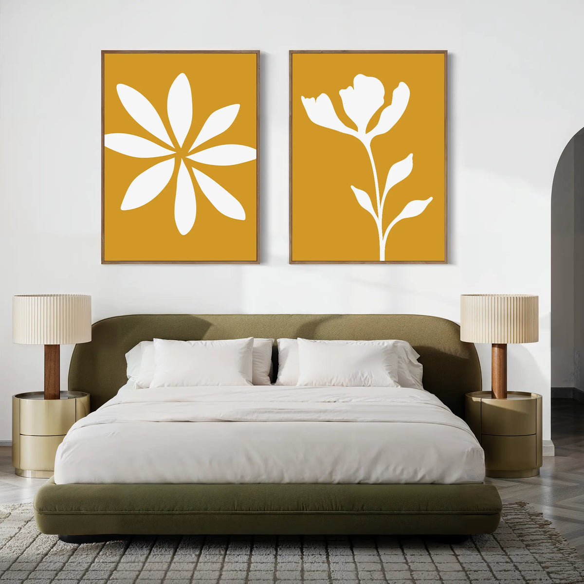 A modern bedroom with a green upholstered bed, white bedding, round nightstands, beige lamps, and the Golden Bloom Set of 2 wall art adds a charming floral touch to the space.