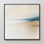 Golden Drift Canvas Art features soft beige, cream, and light blue tones with gentle, blurred transitions and sweeping horizontal lines in a black frame—ideal for adding elegant style to your living room or bedroom decor on light walls.