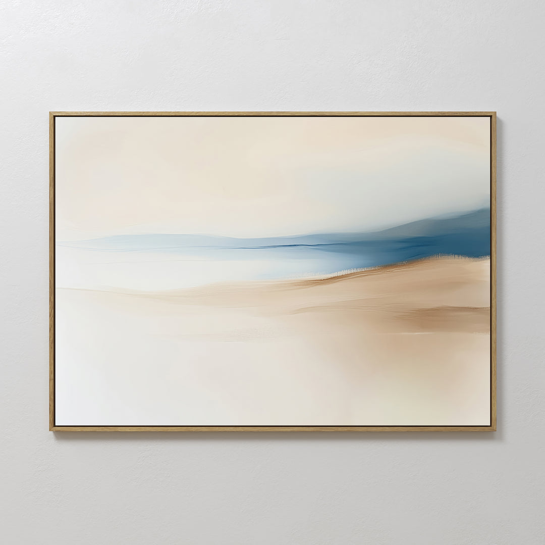 The Golden Drift Canvas Art – Horizontal features minimalist abstract brushstrokes in beige, tan, and blue, evoking a serene landscape. This framed piece is perfect for living room decor and hangs elegantly on any plain white wall.