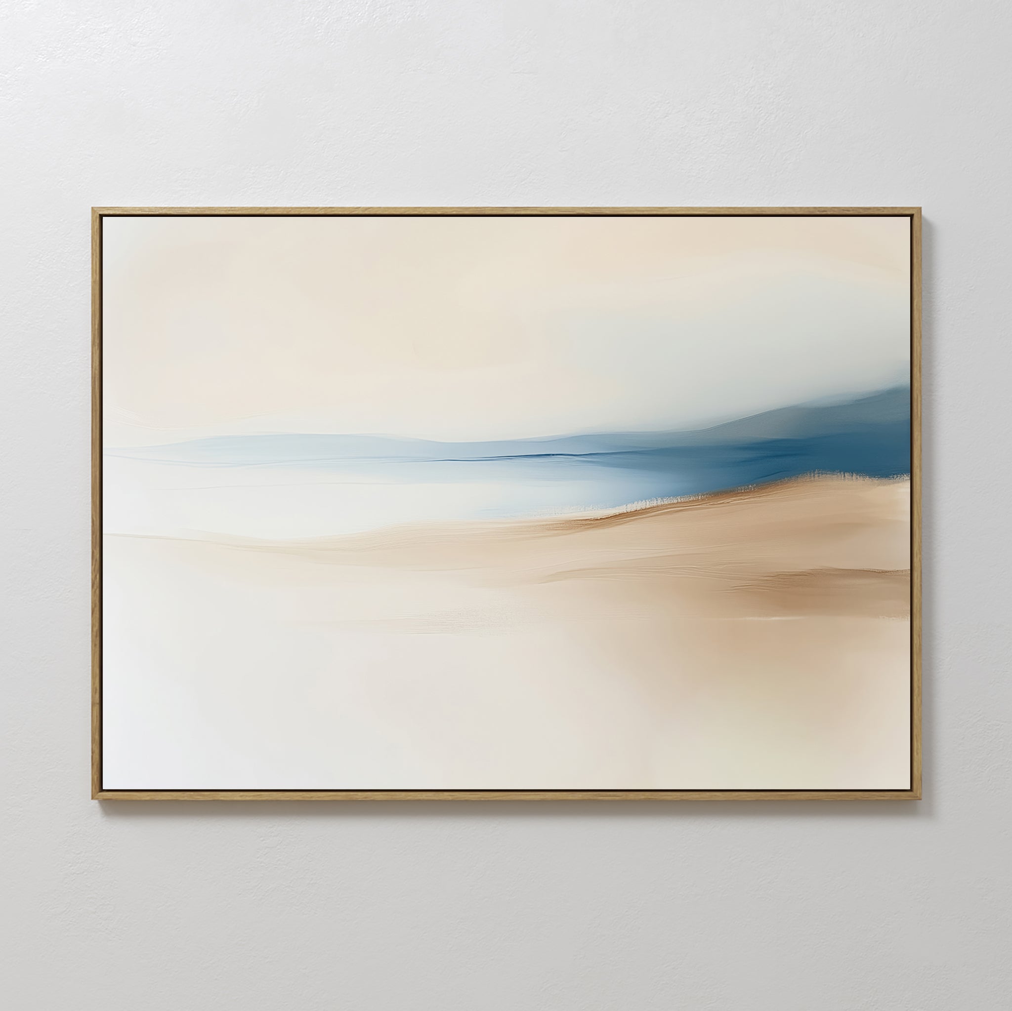 The Golden Drift Canvas Art – Horizontal features minimalist abstract brushstrokes in beige, tan, and blue, evoking a serene landscape. This framed piece is perfect for living room decor and hangs elegantly on any plain white wall.