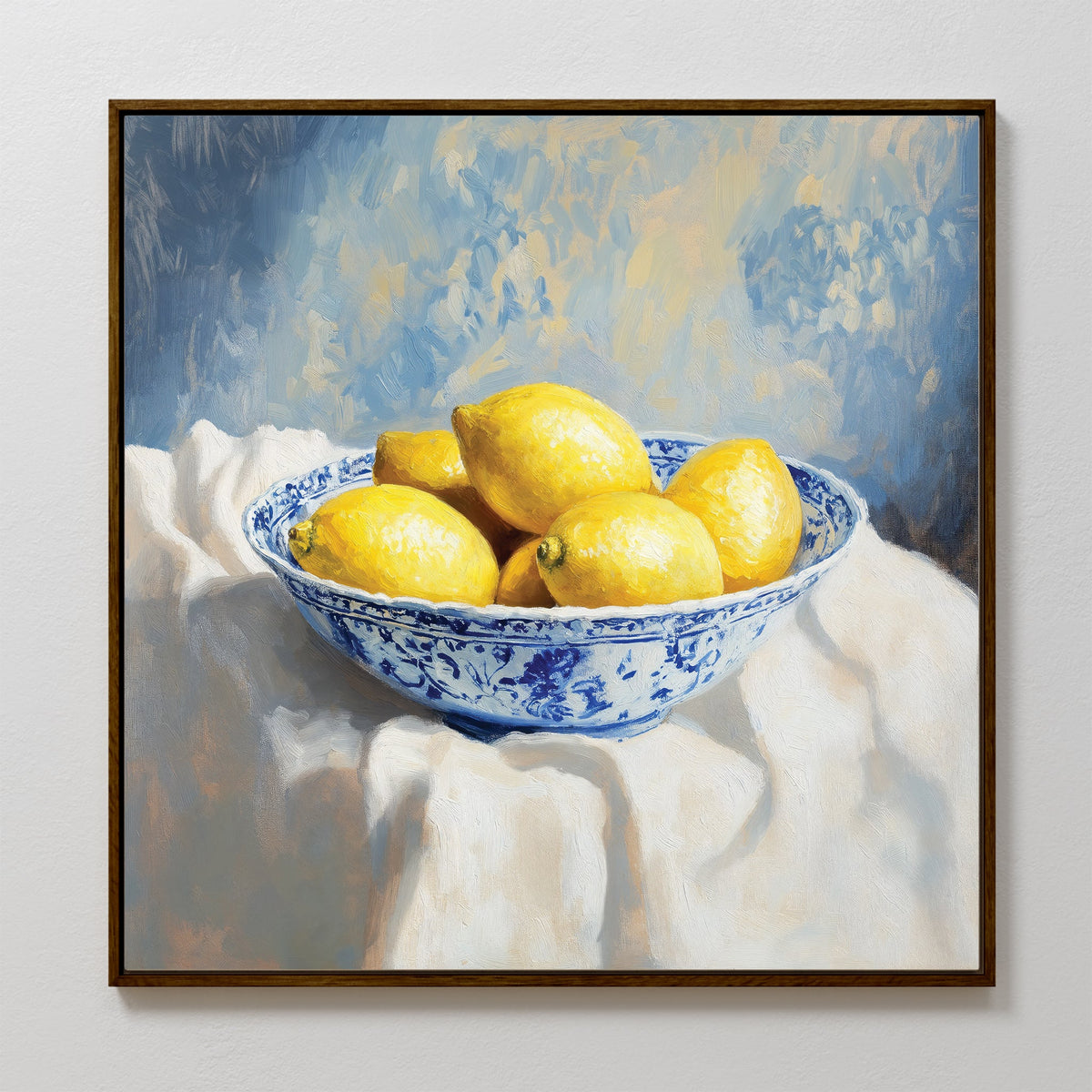 Golden Fruit Canvas Art: A framed canvas print featuring six vibrant yellow lemons in a blue and white bowl on a white cloth with a blue-toned background—perfect rustic wall art to brighten your space.