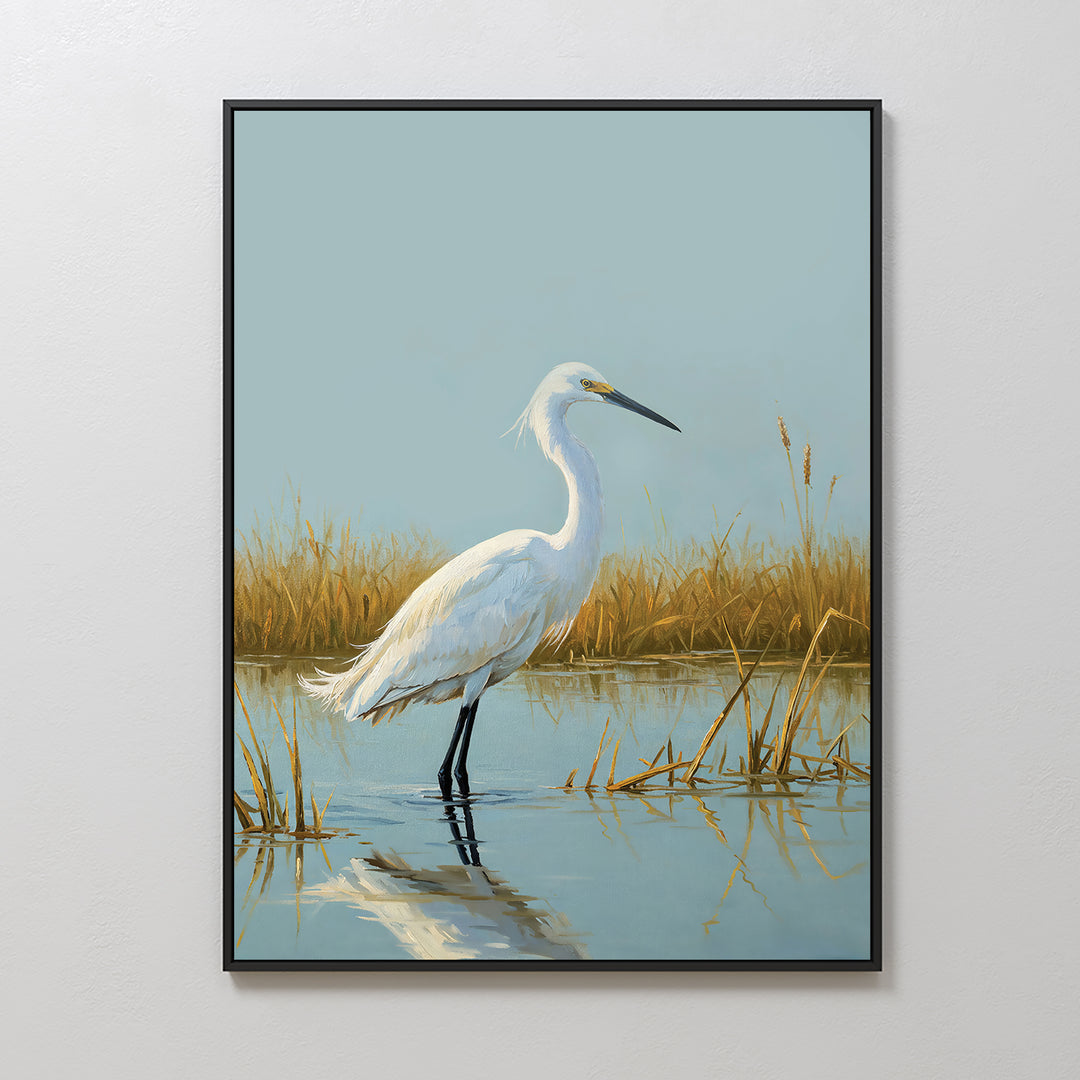 Golden Marsh Egret Canvas Art features a white egret in shallow water with golden marsh grass, its reflection shimmering below and a pale blue sky above—an elegant wall decor piece for a serene home.