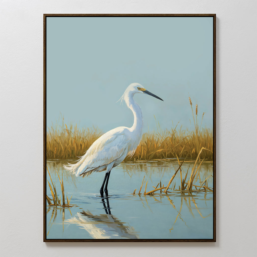 The Golden Marsh Egret Canvas Art features a white egret in shallow water with golden grass and a pale blue sky, making it elegant wall decor to add serene beauty to any space.