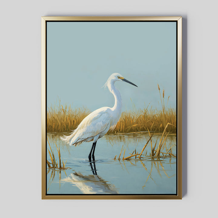 Add tranquil beauty to your space with the Golden Marsh Egret Canvas Art, featuring a white egret in shallow water among golden reeds beneath a blue sky. The bird’s reflection adds serene elegance, making this framed wall art perfect for any room.