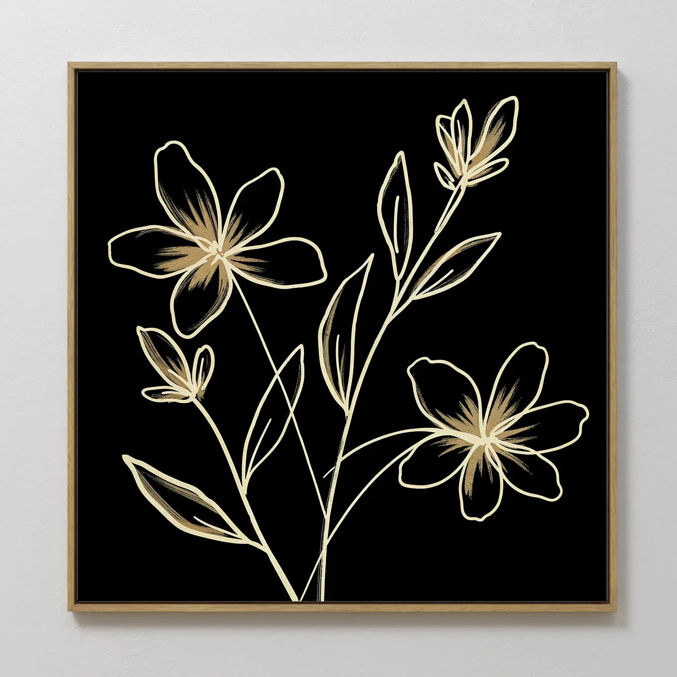 Golden Stems Canvas Art features minimalist light gold flowers and leaves on a black background, set in a simple wooden frame and displayed on a plain white wall—a striking modern decor piece for any space.