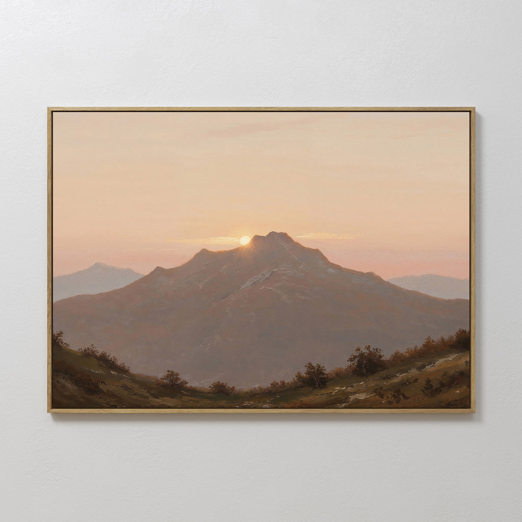 Golden Summit Canvas Art is a framed mountain landscape at sunset in soft orange and pink tones, displayed on a white wall—ideal landscape wall art to enhance your living room or bedroom decor.