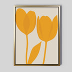 Golden Tulips Abstract Canvas Art features two orange tulip flowers with a single leaf and simple shapes on a light background, framed in thin gold. A minimalist wall art print, it’s perfect for modern living room decor.