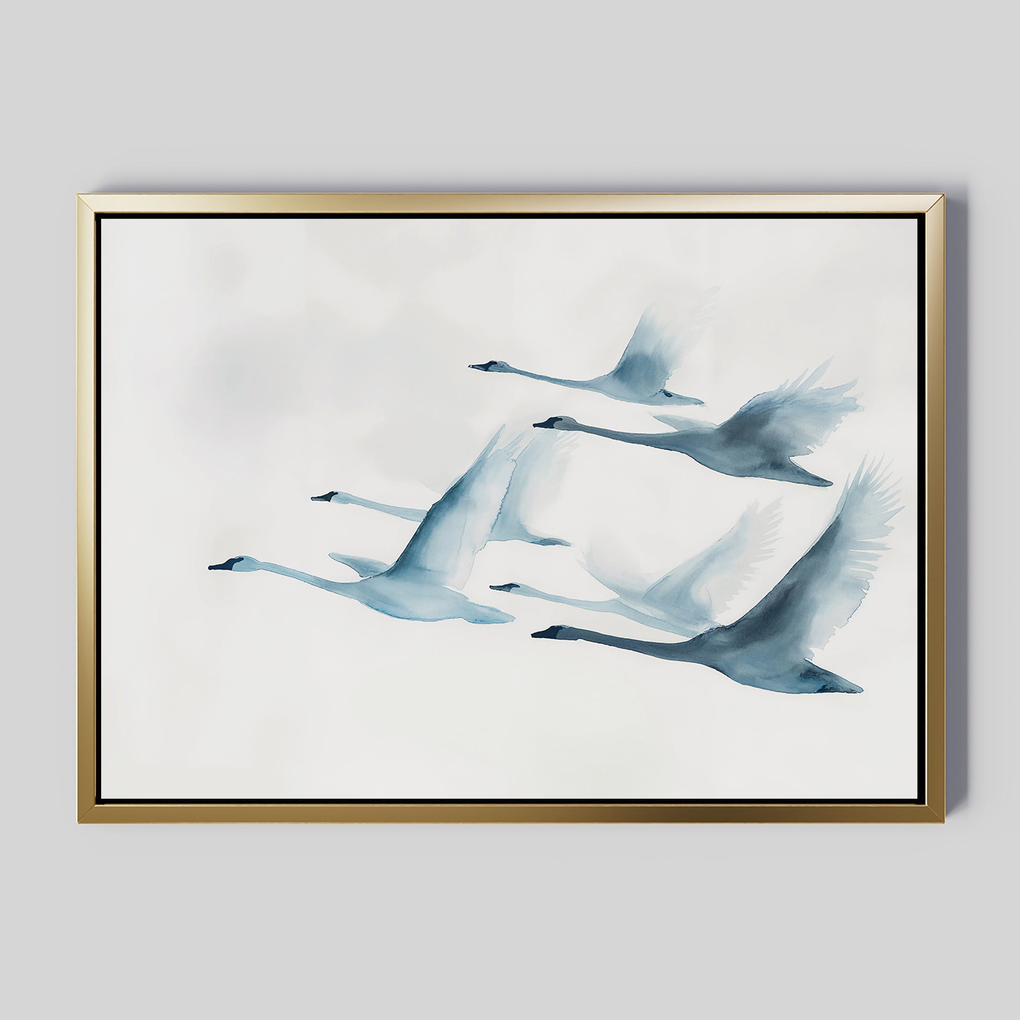 Graceful Flock Canvas Art features six swans in flight rendered in soft blue and gray watercolors on a white backdrop, complemented by a gold frame—ideal for modern nature decor or sophisticated Nordic wall art.