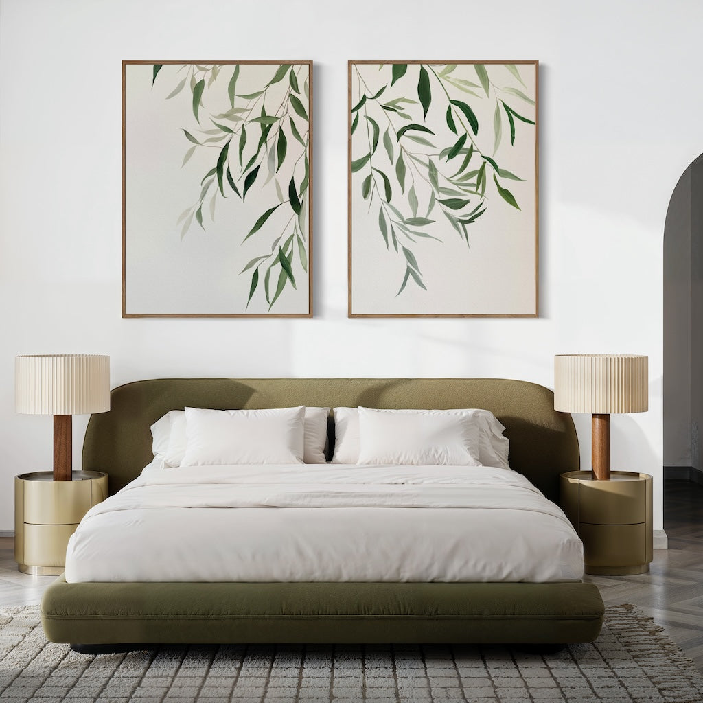 Modern bedroom featuring an olive green upholstered bed, white bedding, two beige nightstands with matching lamps, and the Graceful Leaves Set of 2 wall art above the headboard. A neutral palette and minimalist decor create a serene atmosphere.