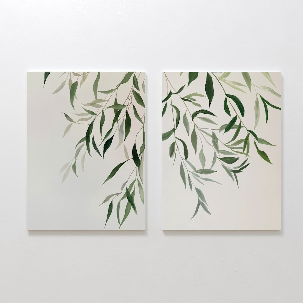 Graceful Leaves Set of 2 features minimalist paintings of green leafy branches on white backgrounds, displayed side by side. This elegant wall art adds subtle sophistication and a fresh touch to your living room decor.