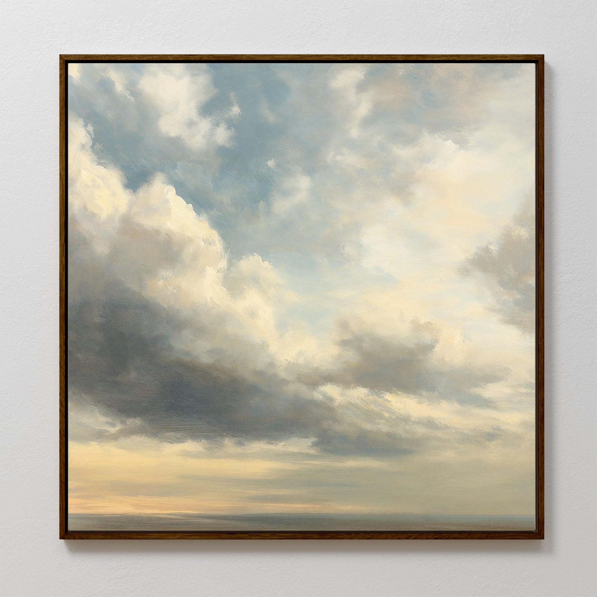 The Heavenly Drift Canvas Art features soft blue, gray, and cream clouds framed on a white wall, bringing a peaceful touch to your living room or perfectly complementing vintage decor.