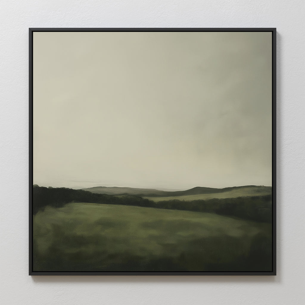 The Hills at Dusk Canvas Art features a framed minimalist misty landscape of rolling green hills, distant mountains, and an overcast sky in soft tones—an elegant wall art print for your living room decor.