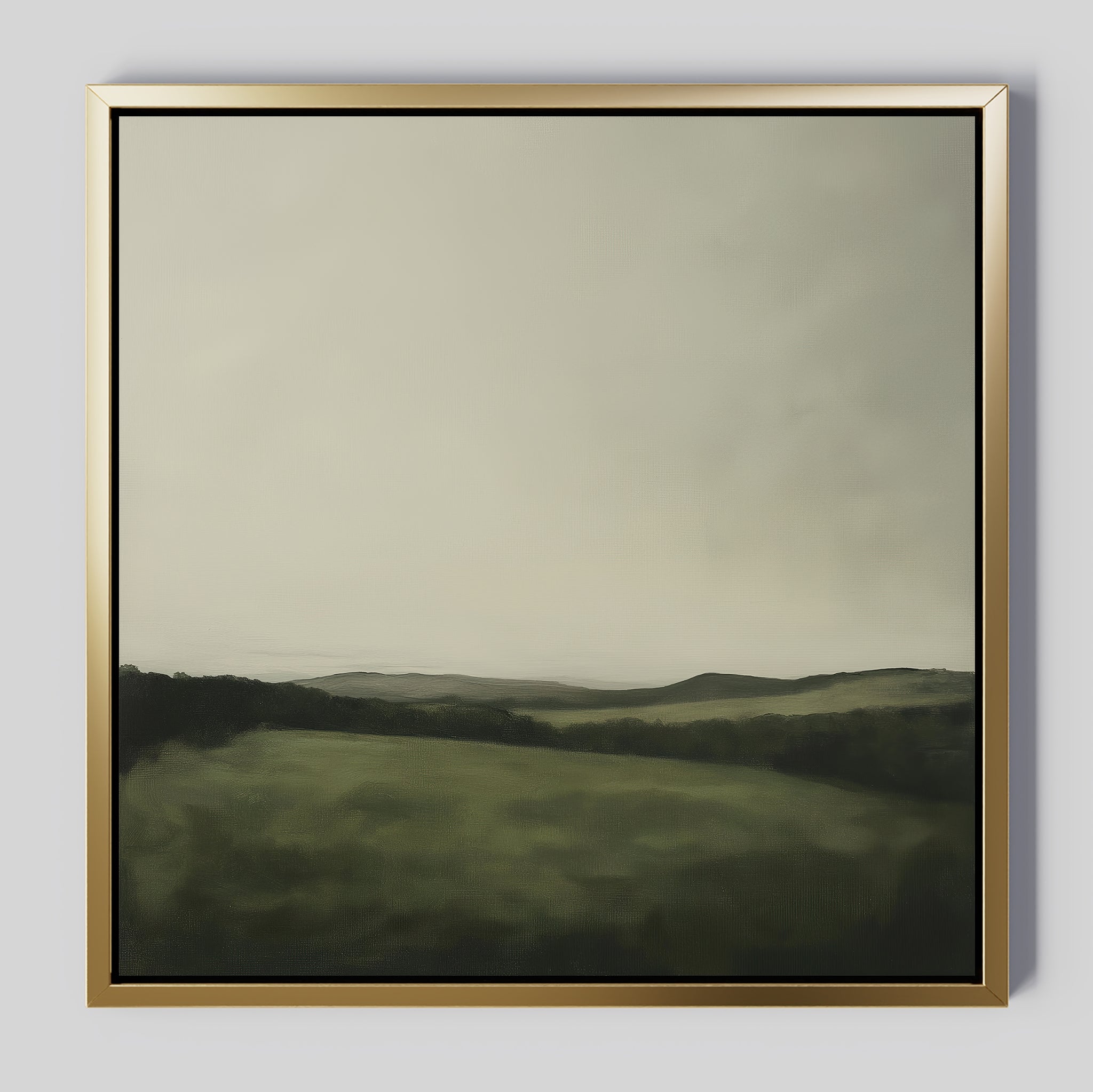 The Hills at Dusk Canvas Art features a misty green landscape with rolling hills and an overcast sky. Its soft, blurred look and muted colors make it a perfect minimalist accent for your living room decor.