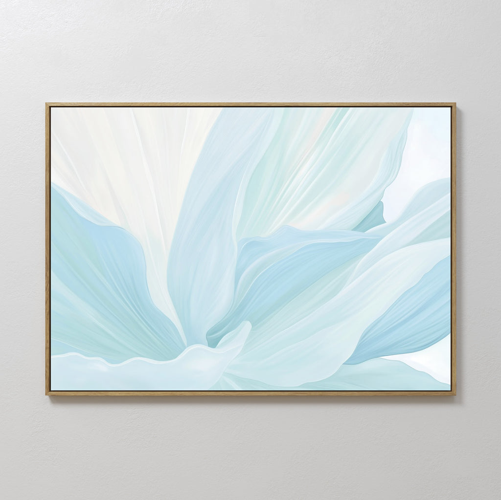 The Icy Petals Abstract Canvas Art features soft, flowing blue and white petals in a minimalist style, ideal as wall art for your living room decor and displayed beautifully against a light-colored wall.