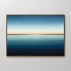 The Indigo Passage Canvas Art – Horizontal showcases a calm blue ocean under a gradient sky, blending deep blue to light orange. This minimalist wall art is perfect for adding peaceful, modern style to your living room decor.