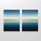 The Indigo Passage Set of 2 features square paintings with calm blue seascapes and soft orange horizons, creating serene minimalist wall art ideal for modern living room decor.