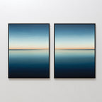 The Indigo Passage Set of 2 features framed paintings of a serene blue seascape with a clear horizon, hung side by side. This minimalist wall art adds tranquility and is ideal for enhancing modern living room decor.