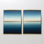 The Indigo Passage Set of 2 features framed abstract paintings with calm blue gradients and a thin orange horizon, creating serene, minimalist wall art perfect for modern living room decor.