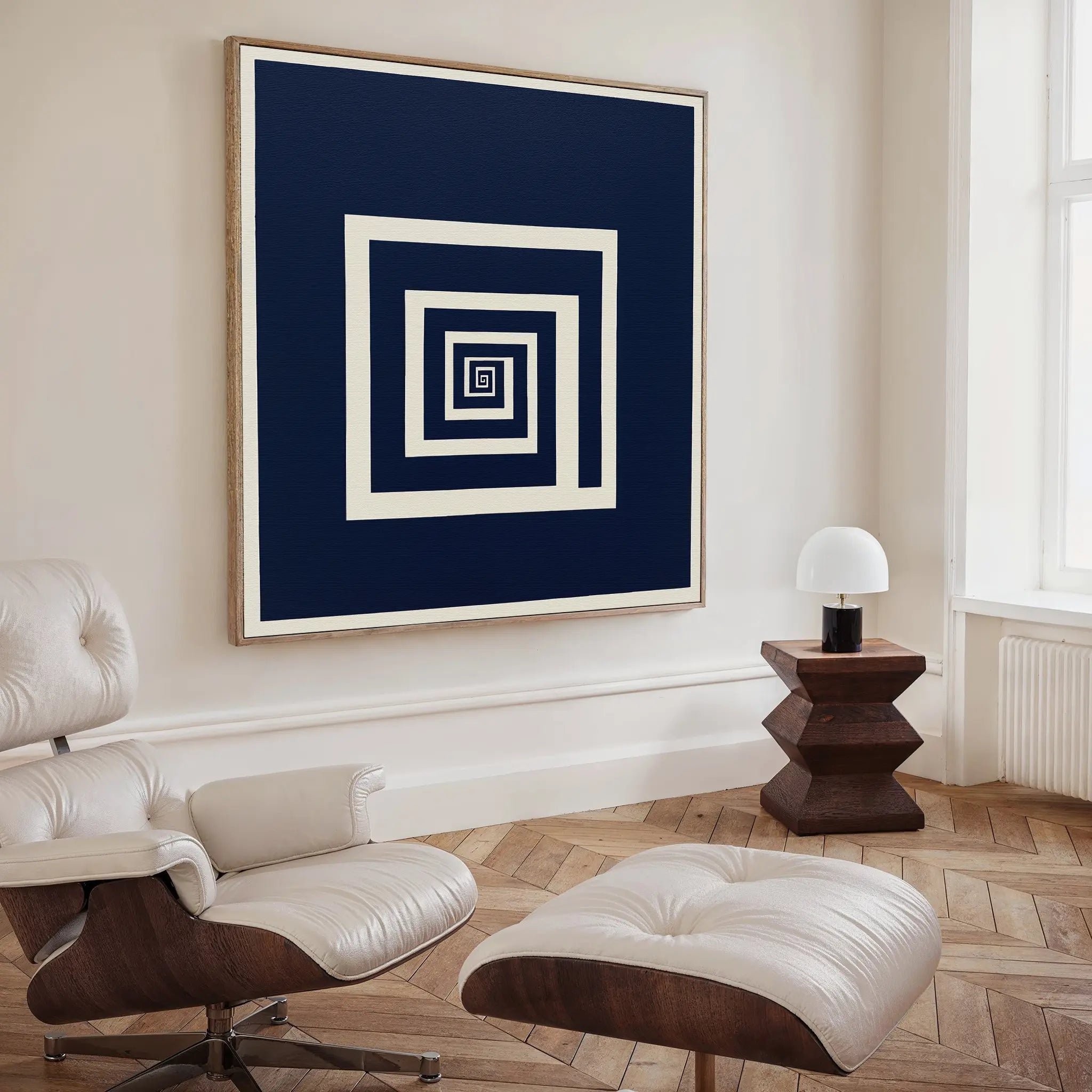 A room featuring the Infinite Descent Canvas Art framed on the wall, bringing a touch of modern minimalist decor.