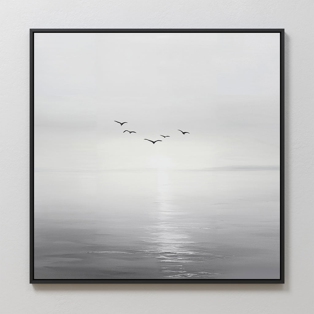 Into the Light Canvas Art features a minimalist design of five birds soaring above a tranquil sea beneath a pale sky—perfect for creating a serene and calming atmosphere in your living room.