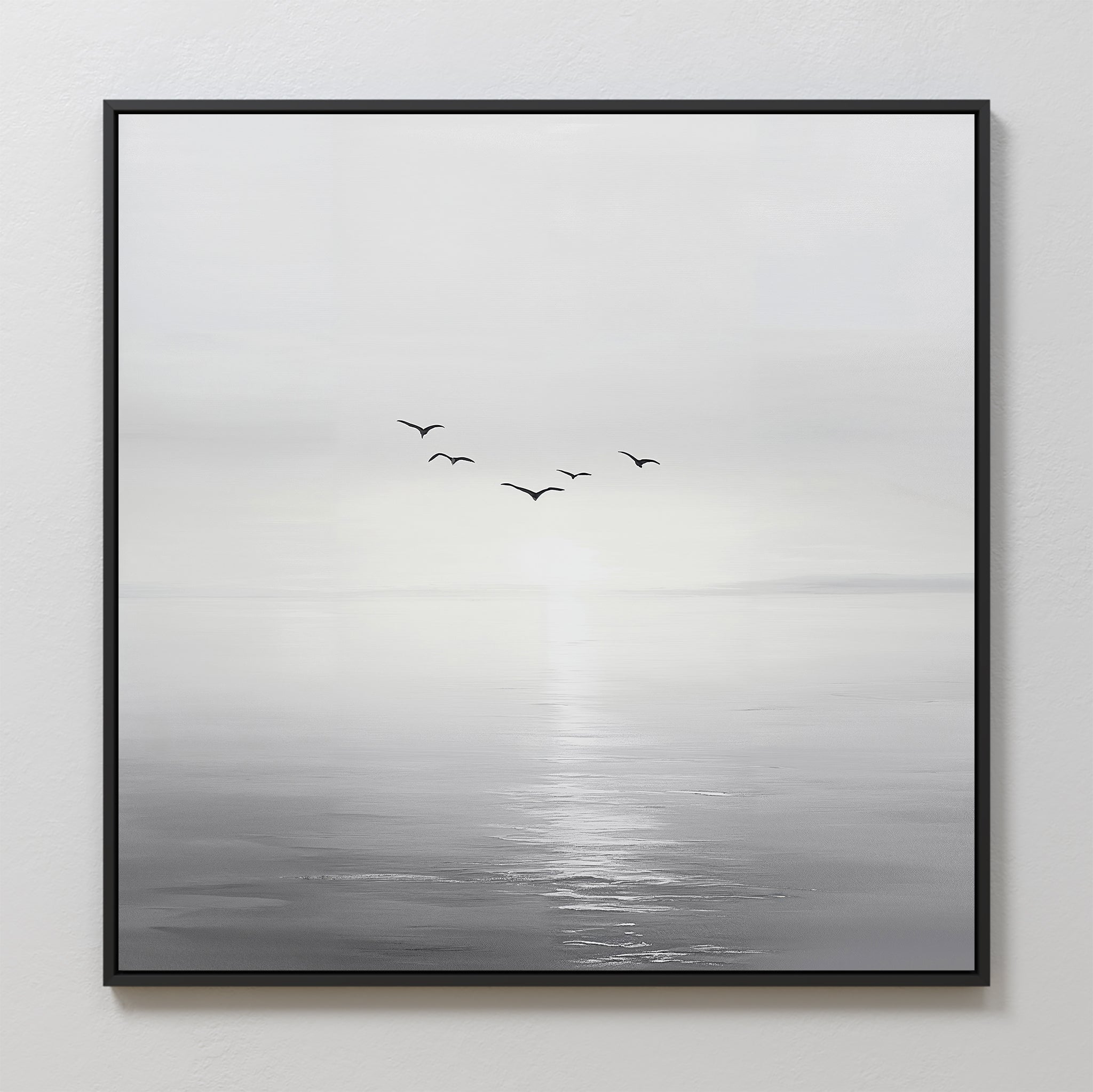 Into the Light Canvas Art features a minimalist design of five birds soaring above a tranquil sea beneath a pale sky—perfect for creating a serene and calming atmosphere in your living room.