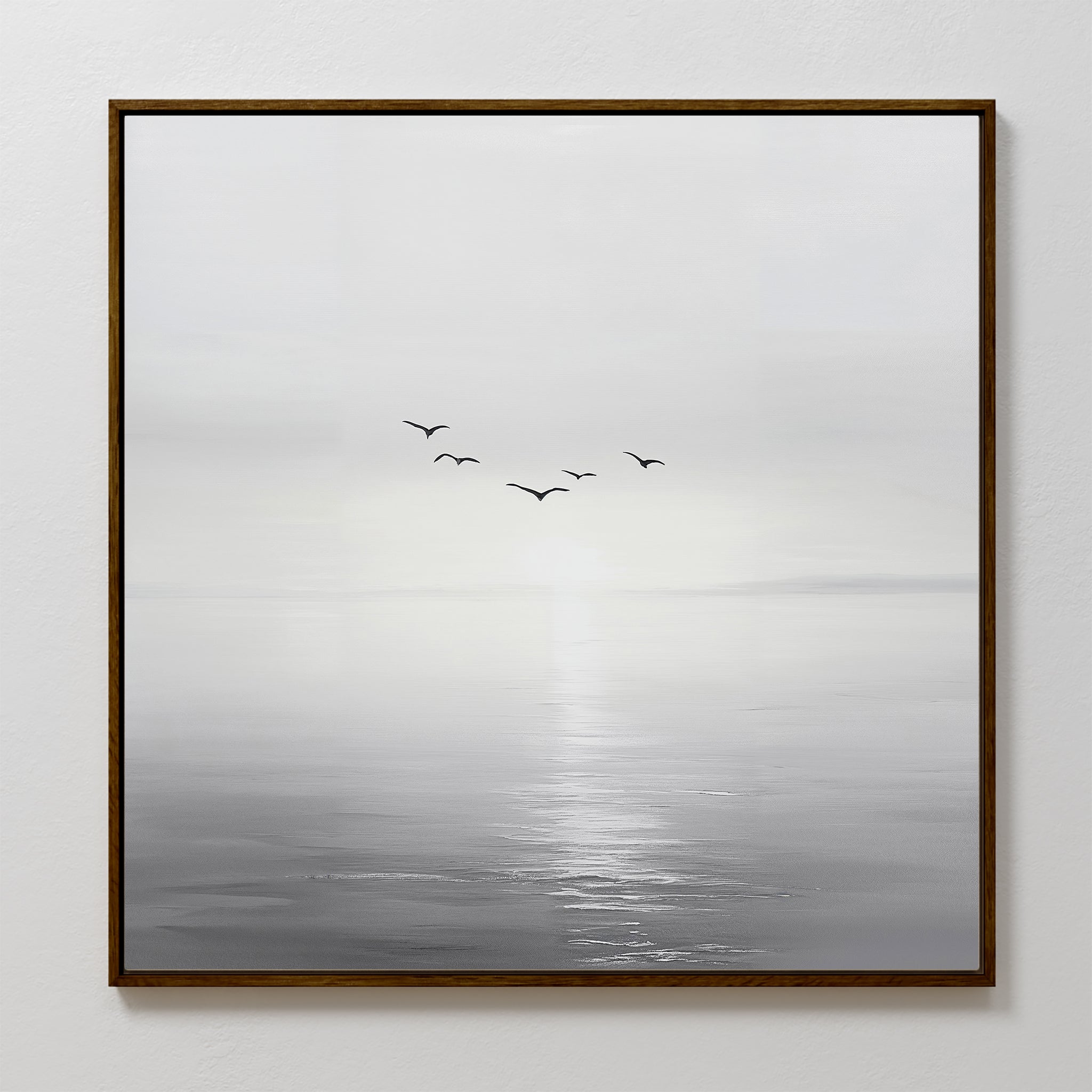 The Into the Light Canvas Art features five birds soaring over calm water with reflected light, creating serene black and white minimalist wall art ideal for living room decor.