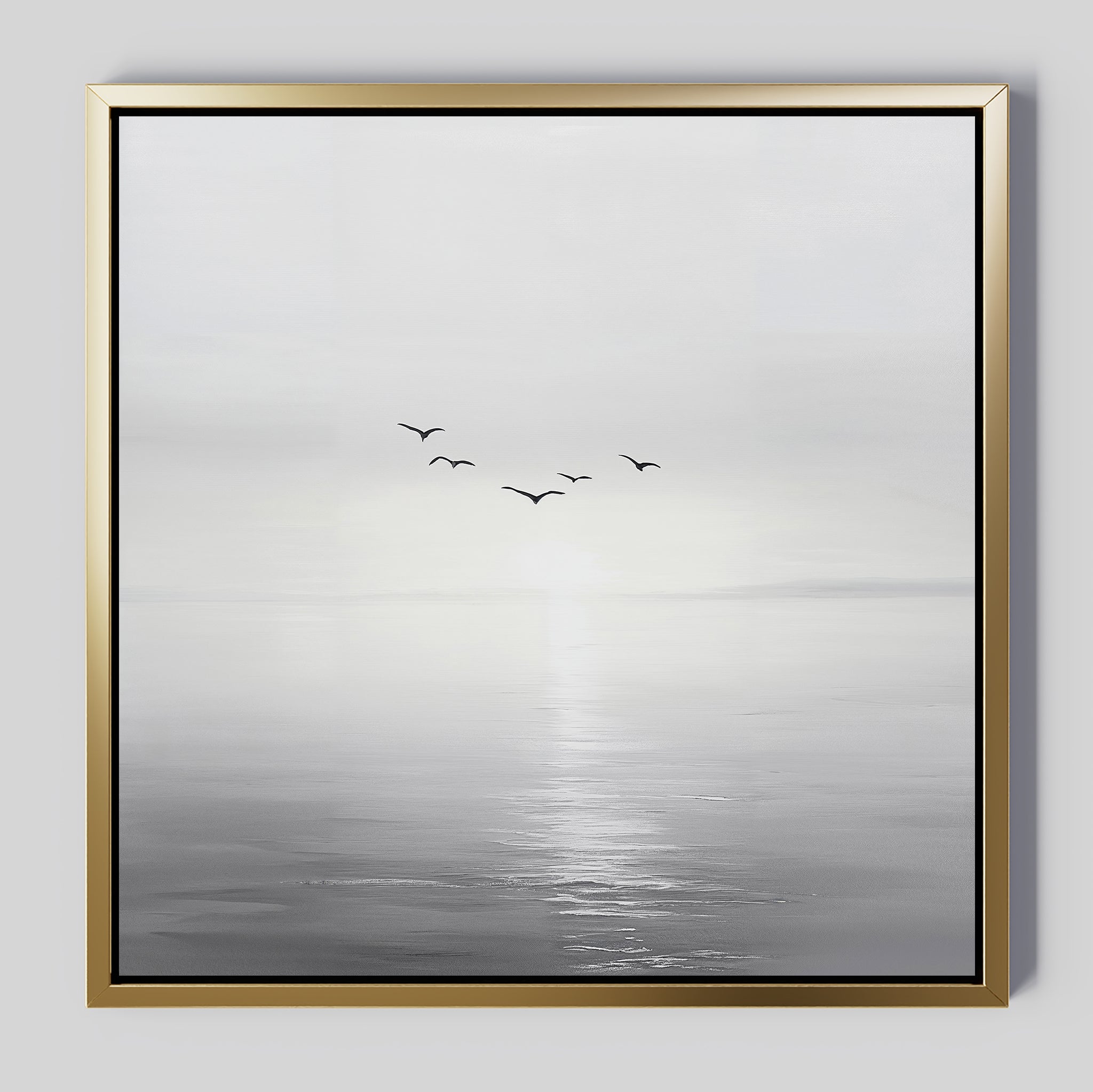 The Into the Light Canvas Art is a framed minimalist artwork featuring a calm grayscale seascape with the sun low on the horizon and five birds in flight—a serene wall art piece to elevate your living room decor.