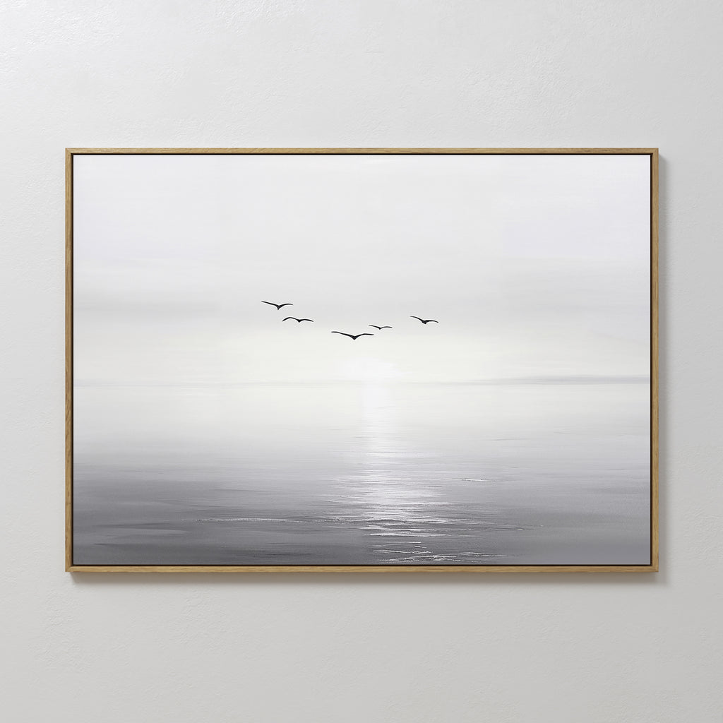 Into the Light Canvas Art – Horizontal: a minimalist framed painting of a serene gray and white seascape with sunlight on the water and five birds—ideal wall art for enhancing your living room decor.