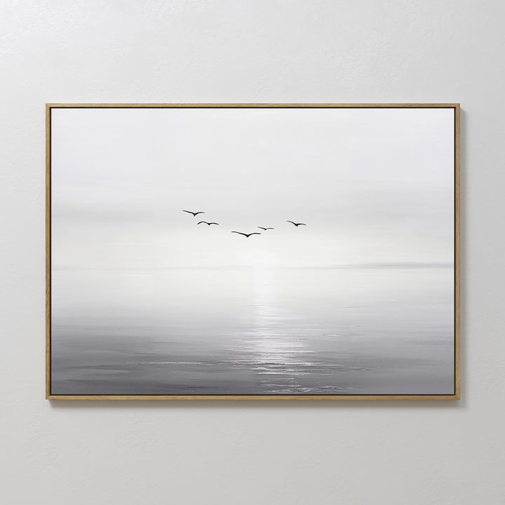 Into the Light Canvas Art – Horizontal: a minimalist framed painting of a serene gray and white seascape with sunlight on the water and five birds—ideal wall art for enhancing your living room decor.