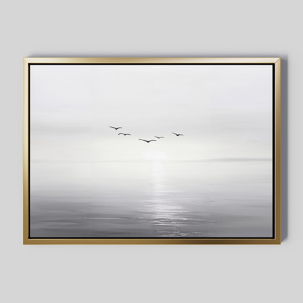 The "Into the Light Canvas Art – Horizontal" features a minimalist grayscale seascape with gentle waves and five birds over calm water beneath a misty sky—ideal for adding serene style to your living room décor.
