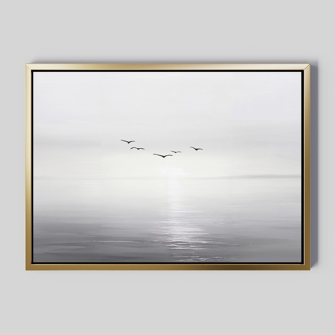 The "Into the Light Canvas Art – Horizontal" features a minimalist grayscale seascape with gentle waves and five birds over calm water beneath a misty sky—ideal for adding serene style to your living room décor.
