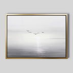 The "Into the Light Canvas Art – Horizontal" features a minimalist grayscale seascape with gentle waves and five birds over calm water beneath a misty sky—ideal for adding serene style to your living room décor.