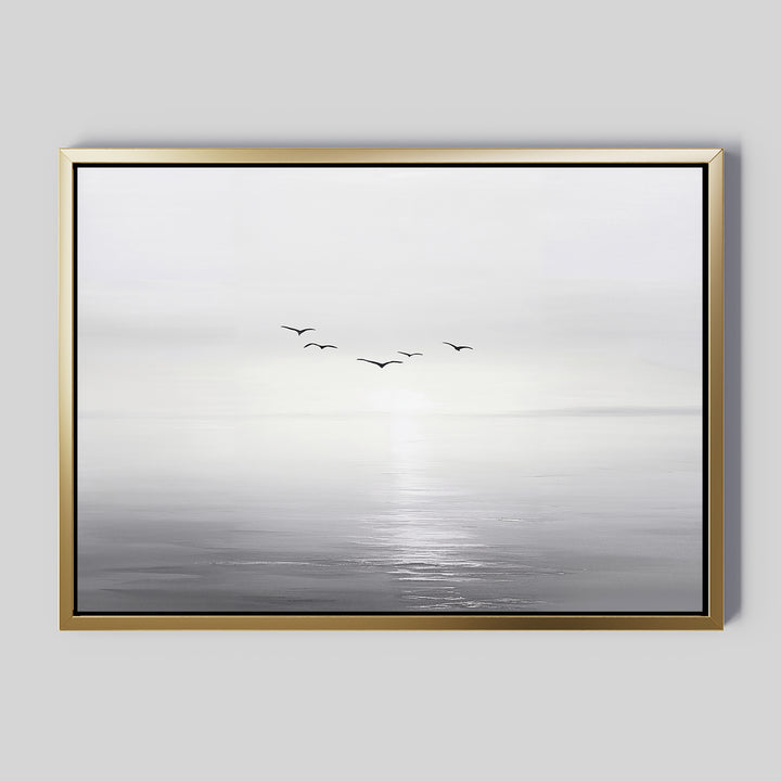 The "Into the Light Canvas Art – Horizontal" features a minimalist grayscale seascape with gentle waves and five birds over calm water beneath a misty sky—ideal for adding serene style to your living room décor.