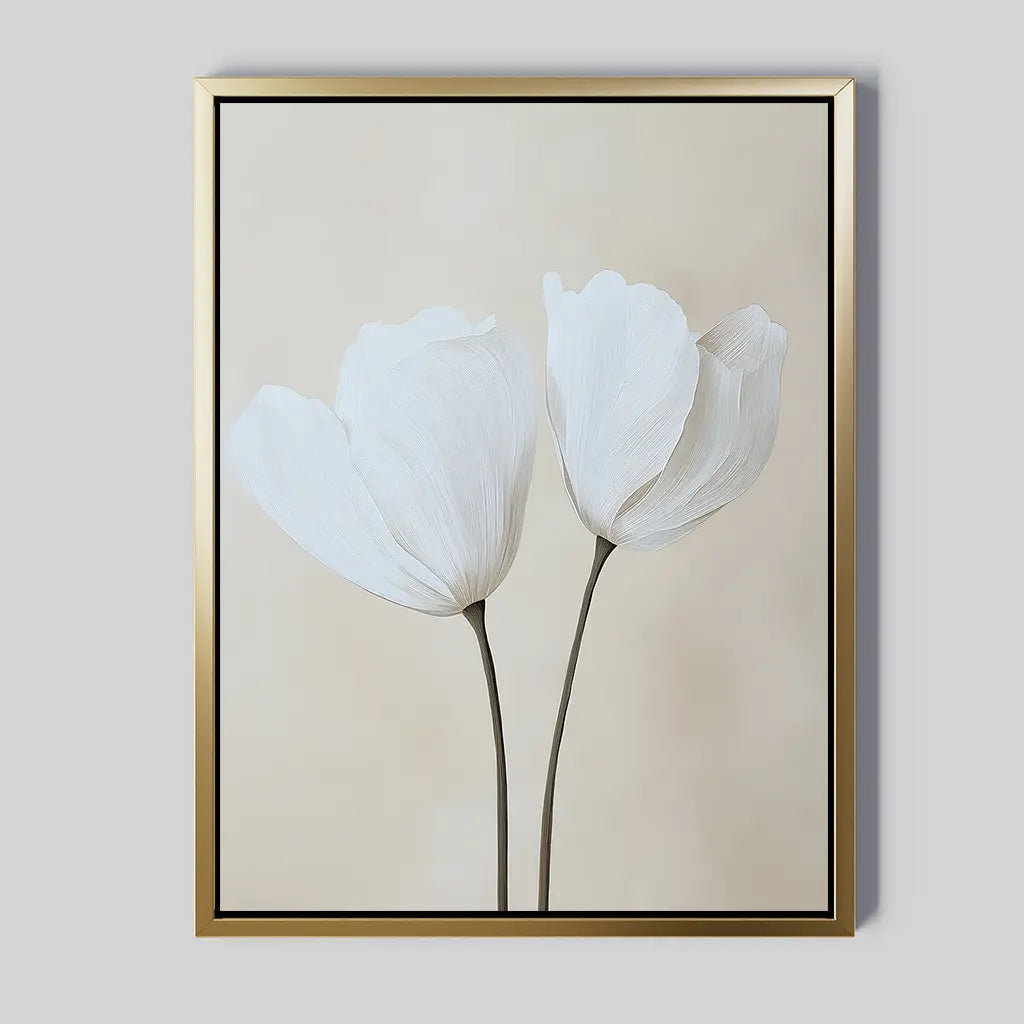 The Ivory Buds Canvas Art features two delicate white flowers with long stems on a light beige background in a slim gold frame—ideal for minimalist or neutral-toned interiors.