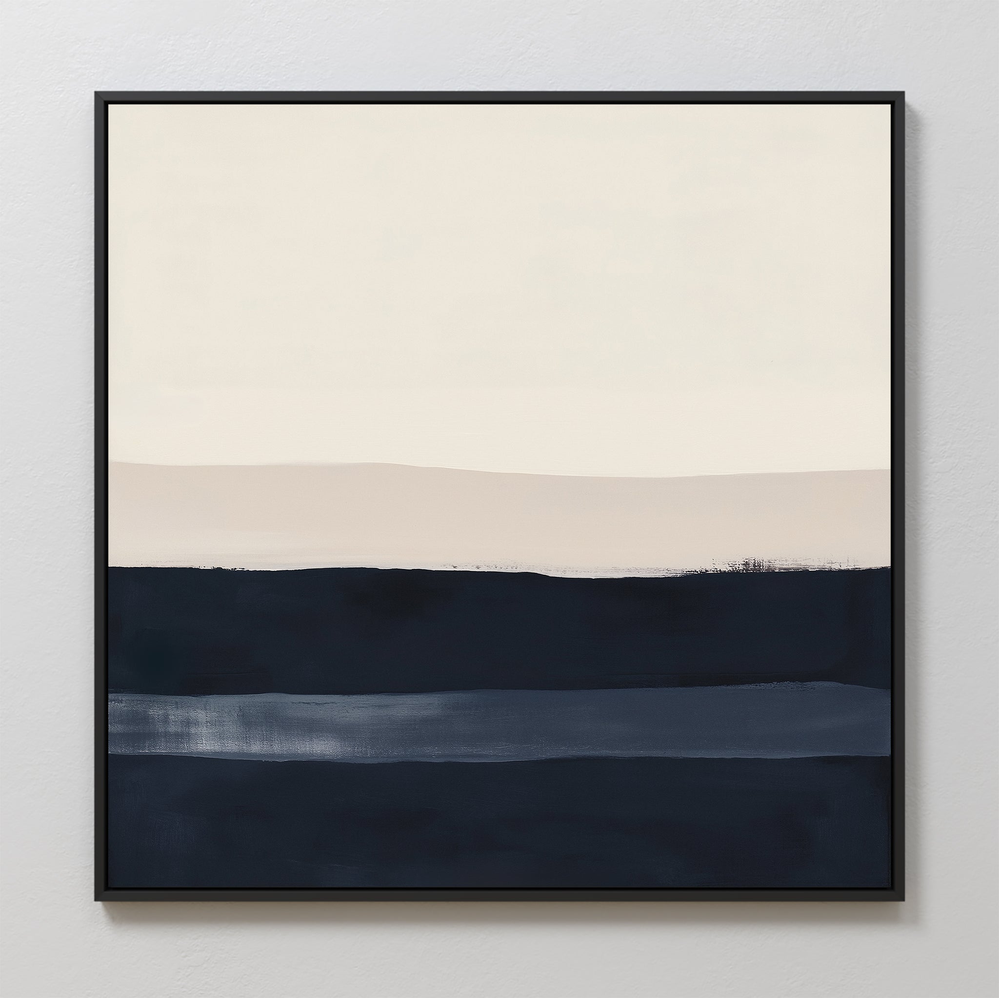 Ivory Dusk Canvas Art showcases abstract horizontal bands in navy, blue, beige, and cream with softly blended edges. Presented in a thin black frame, its perfect for modern interiors and looks stunning on white walls.
