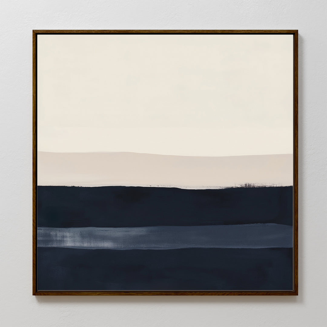 The Ivory Dusk Canvas Art features horizontal bands of off-white, light beige, and deep blue on canvas, framed in dark wood—an elegant modern accent for crisp white walls.