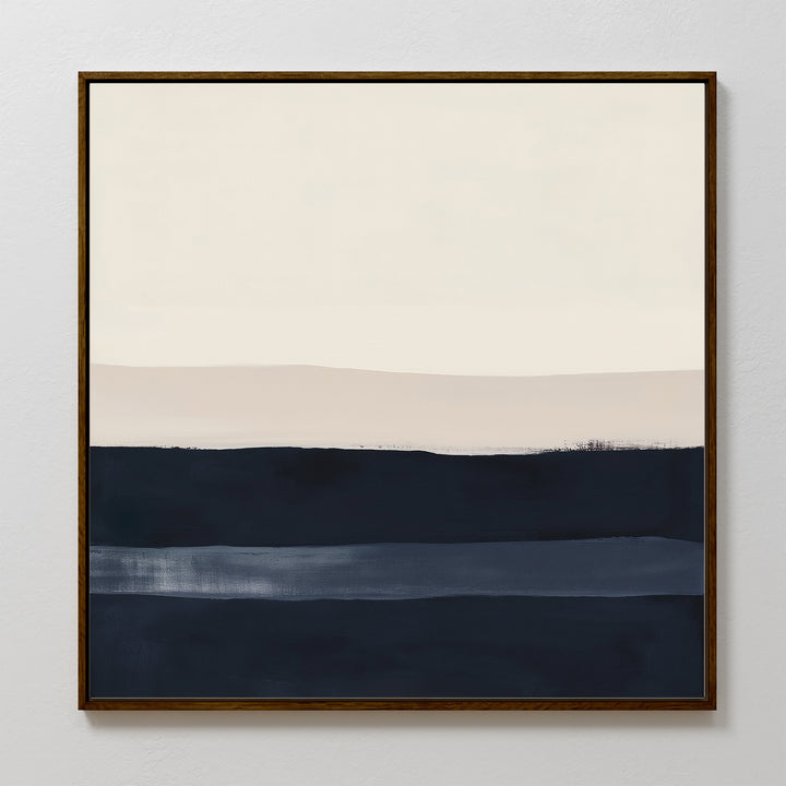 The Ivory Dusk Canvas Art features horizontal bands of off-white, light beige, and deep blue on canvas, framed in dark wood—an elegant modern accent for crisp white walls.