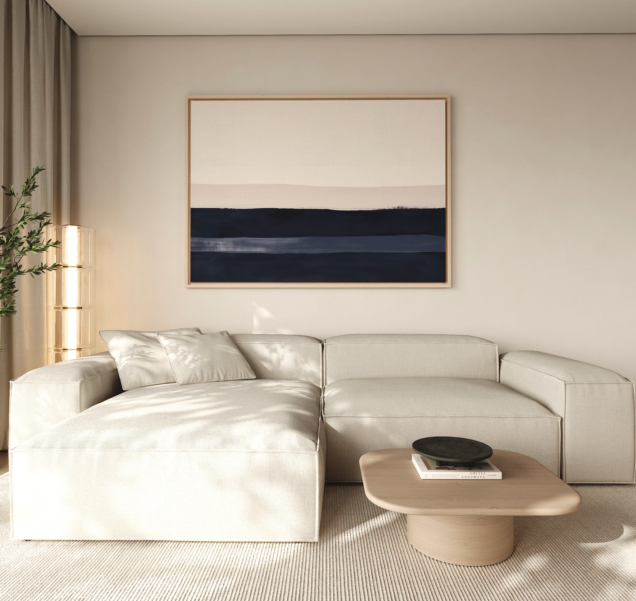 A modern living room with a light beige sectional, low wooden coffee table with a black bowl, Ivory Dusk Canvas Art – Horizontal in blue and beige tones on the wall, and a tall plant by sheer curtains—ideal for stylish decor.