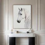 The Ivory Mane Canvas Art, a framed white horse print, hangs above a marble-top console with candles and vases, adding minimalist elegance—perfect wall decor for lovers of contemporary art.