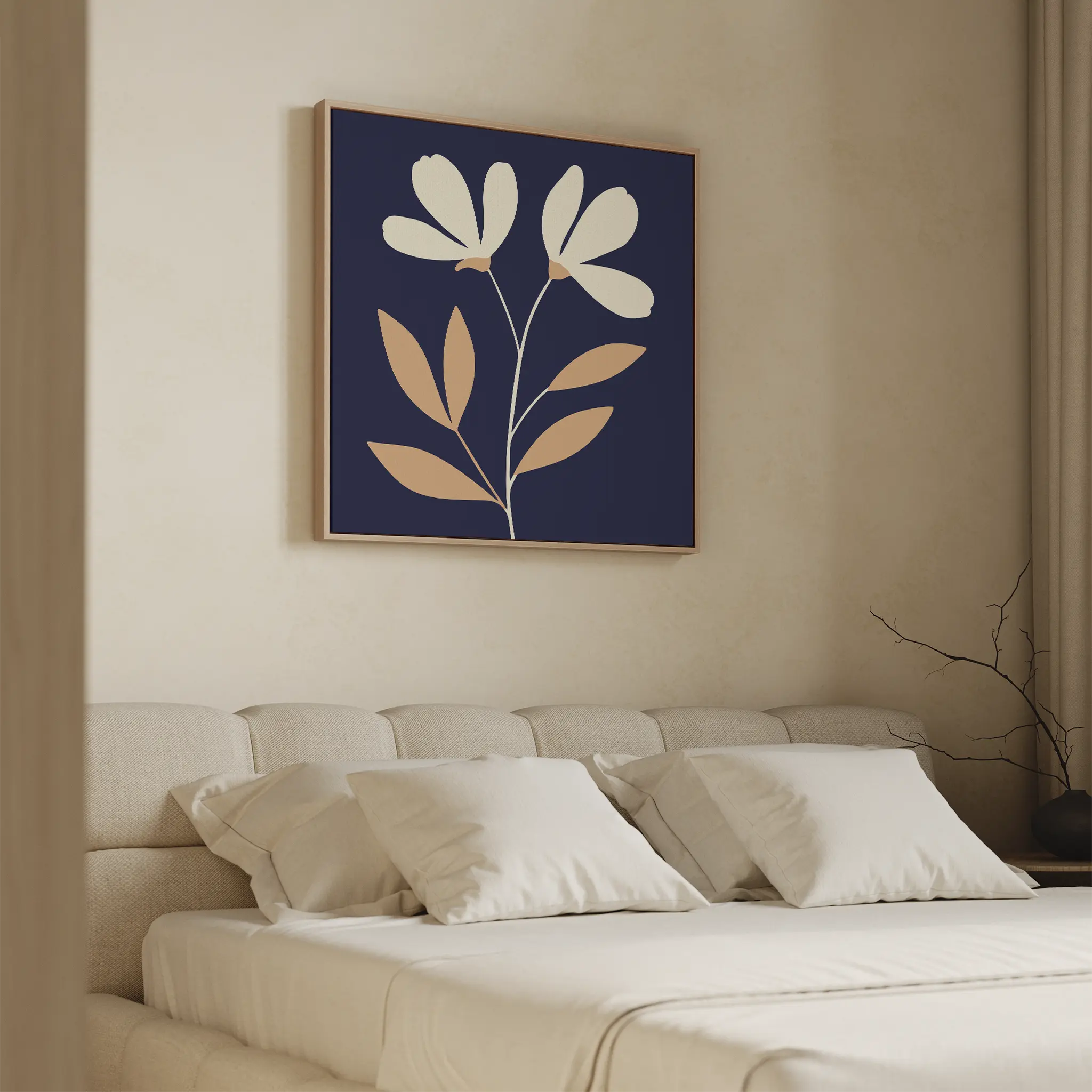 A beige bed with white pillows sits in soft light. Above, the Ivory Stems Canvas Art features a minimalist floral design of white flowers and brown leaves on dark blue. A bare branch decorates the nightstand.