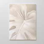 Leaf Whisper Abstract Canvas Art is a large, minimalist wall piece showcasing a pale monochromatic monstera leaf with soft lines and shading—ideal for bringing Nordic Park elegance to any neutral room.