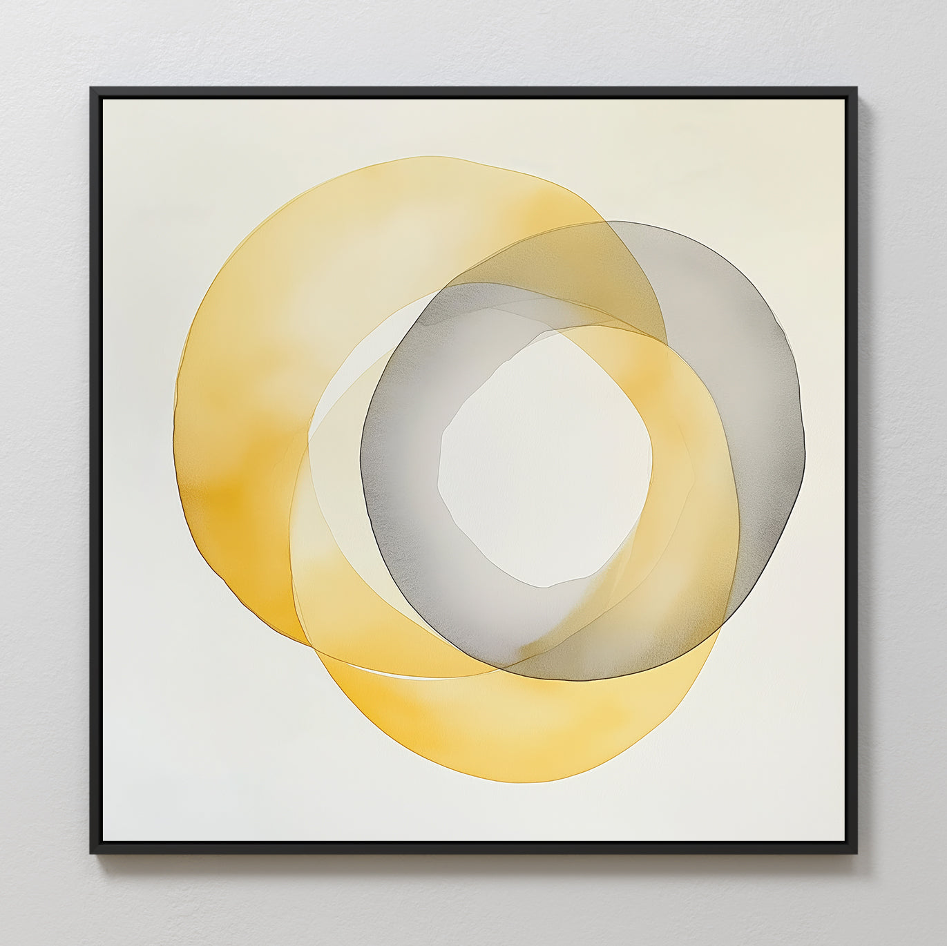 Lemon Light Canvas Art features two overlapping translucent rings—one yellow, one gray—on a light background. Framed in simple black, this modern abstract piece blends soft shades at the center for a stylish decor accent.