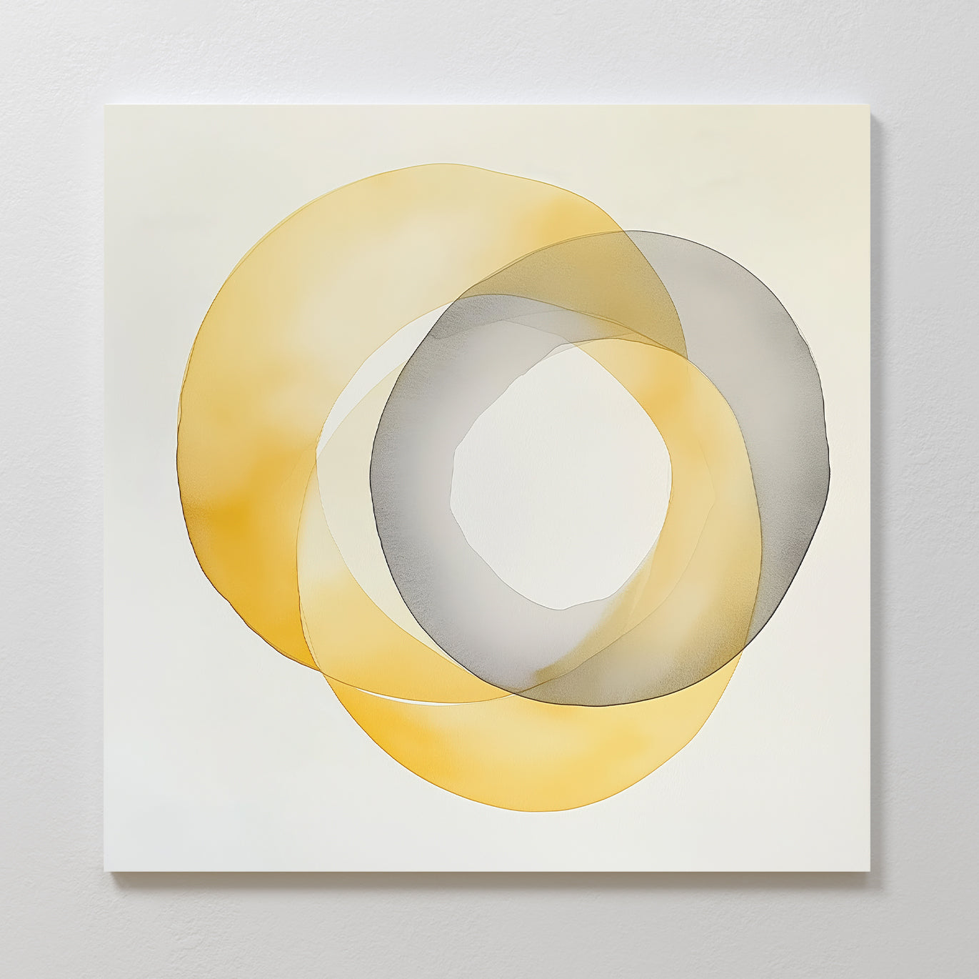 Lemon Light Canvas Art features two overlapping translucent rings—golden yellow and gray—on a white background, creating modern wall decor with intersecting shapes and subtle, blended layers of color.