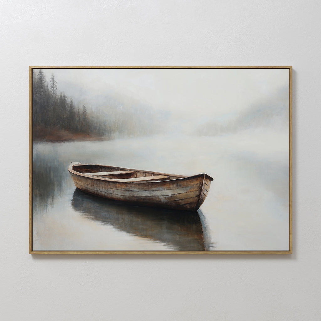Lonely Boat Canvas Art features a framed painting of a wooden rowboat on calm, misty water with a foggy forest and distant shoreline—a serene wall art piece perfect for bringing peaceful decor to any space.