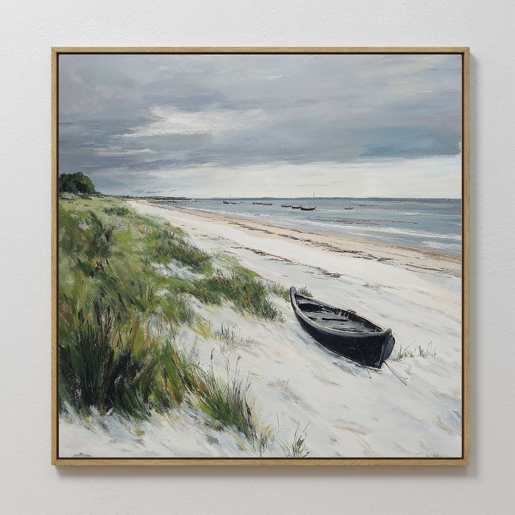 Lonely Coast Canvas Art: A large wall print of a sandy beach with tall grass, a black rowboat on the shore, calm waves, and distant boats beneath a cloudy sky—ideal for tranquil home decor.